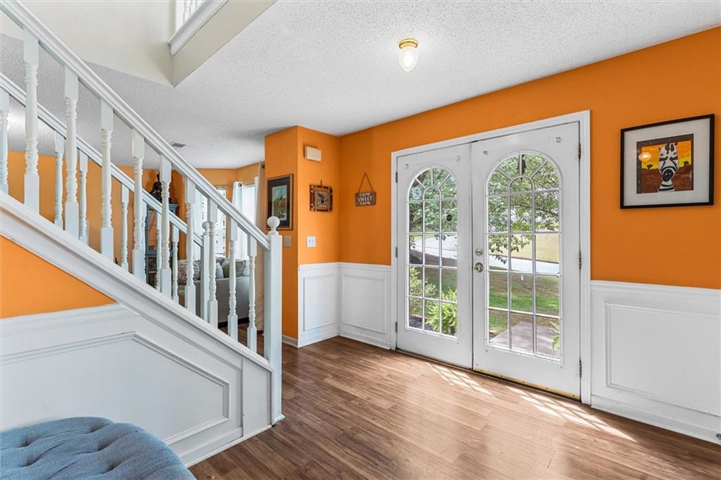 3234 Mineral Ridge Lane Stone Mountain, GA 30087 - Photo 3 of 55 a view of an entryway with wooden floor and windows