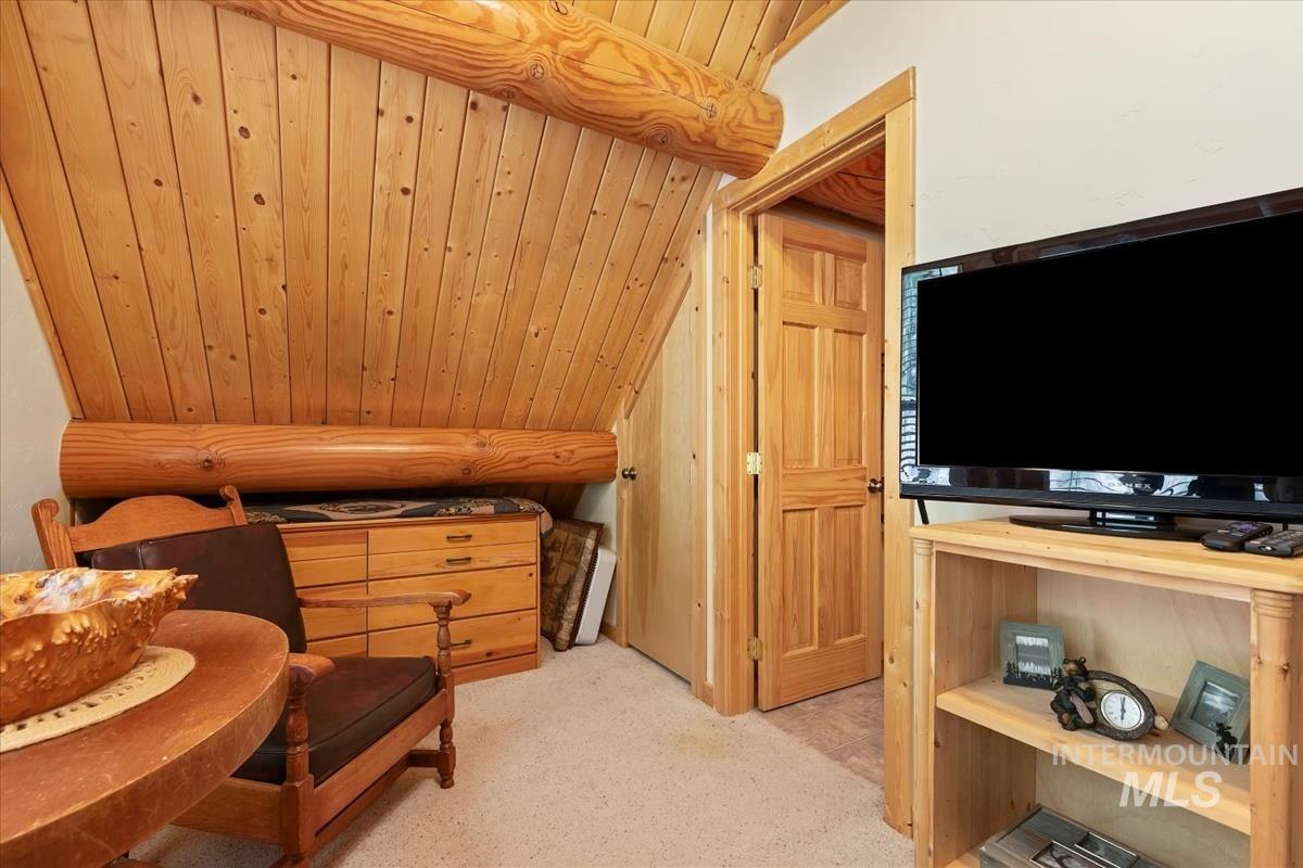 10 Elk Point Road Garden Valley, ID 83622 - Photo 29 of 42 Living area with a vaulted wooden ceiling