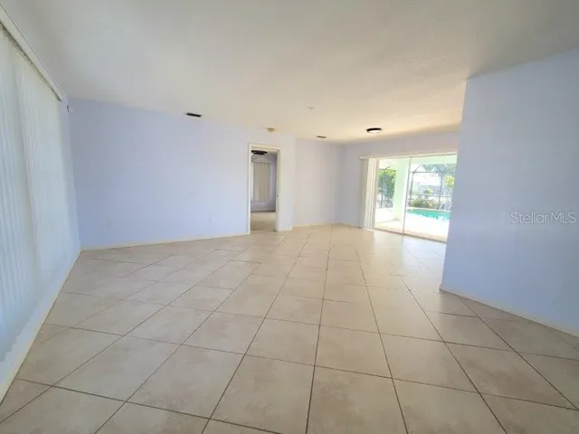 a view of an empty room with a window