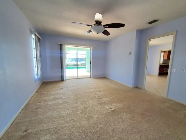 a view of an empty room with a window