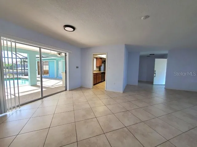 a view of an empty room and window