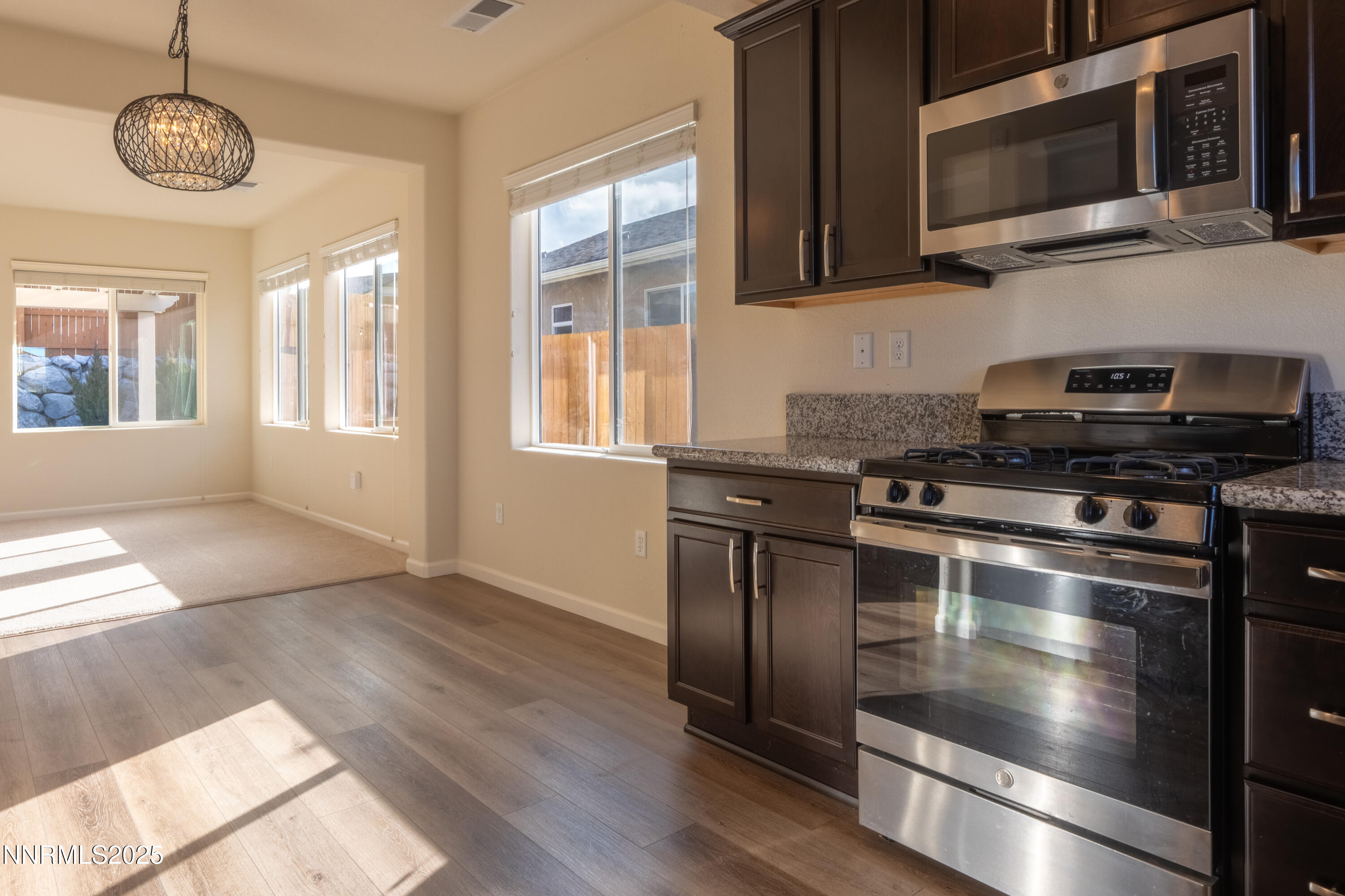 14524 Leiden Drive Reno, NV 89506 - Photo 11 of 33 a kitchen with a stove and a microwave