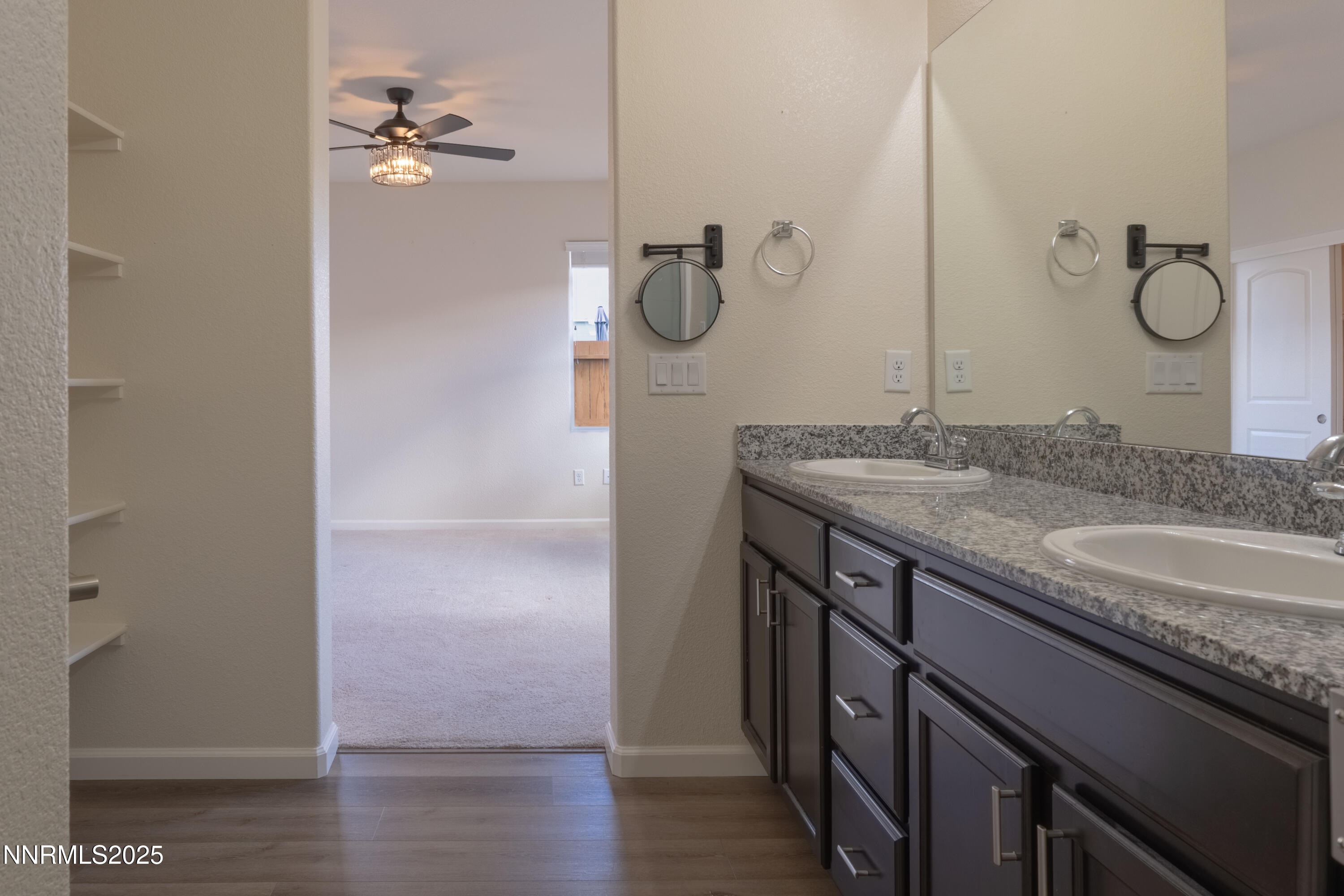 14524 Leiden Drive Reno, NV 89506 - Photo 17 of 33 a bathroom with a granite countertop sink a mirror and shower
