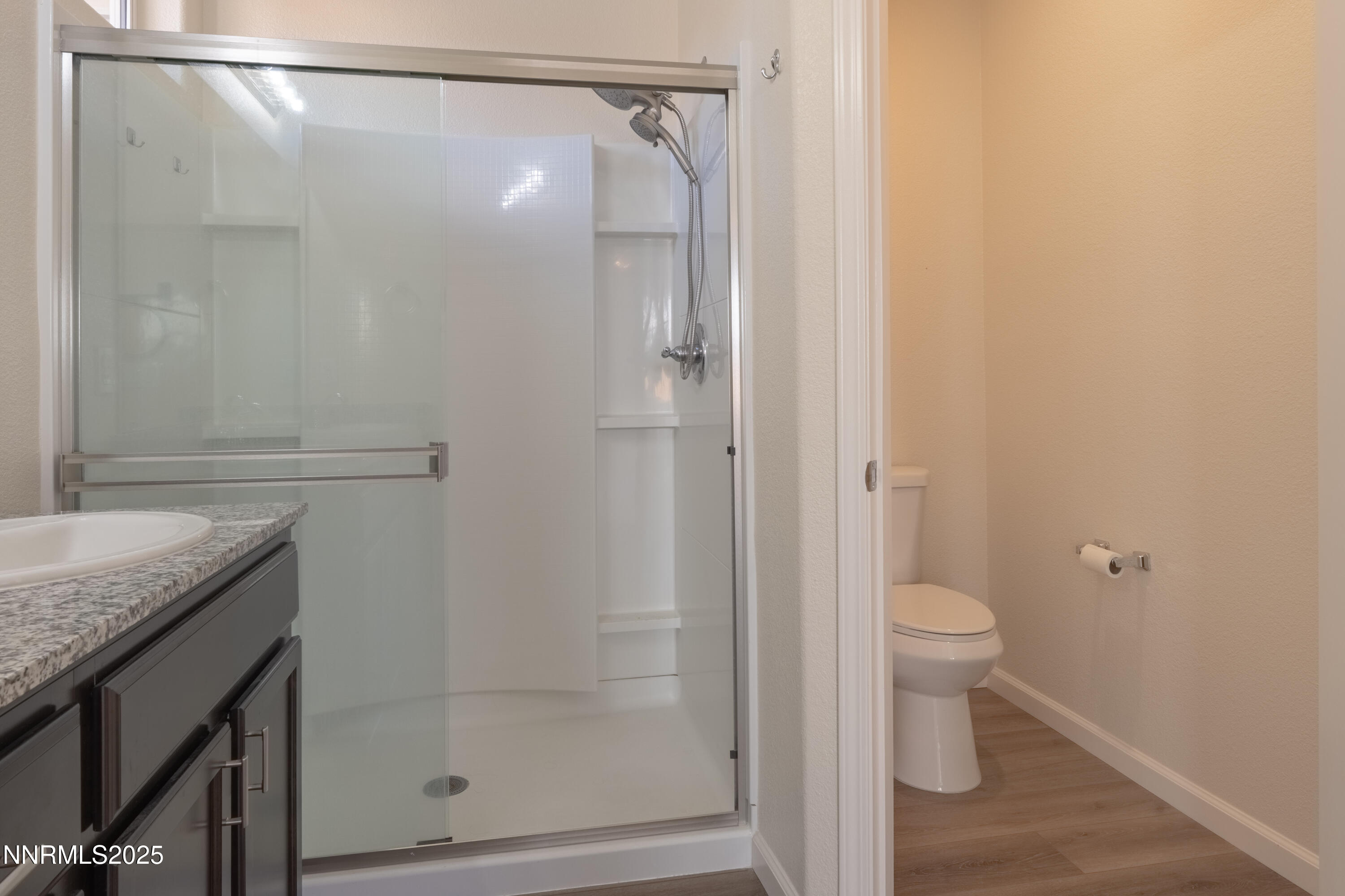 14524 Leiden Drive Reno, NV 89506 - Photo 18 of 33 a bathroom with a granite countertop sink toilet and shower