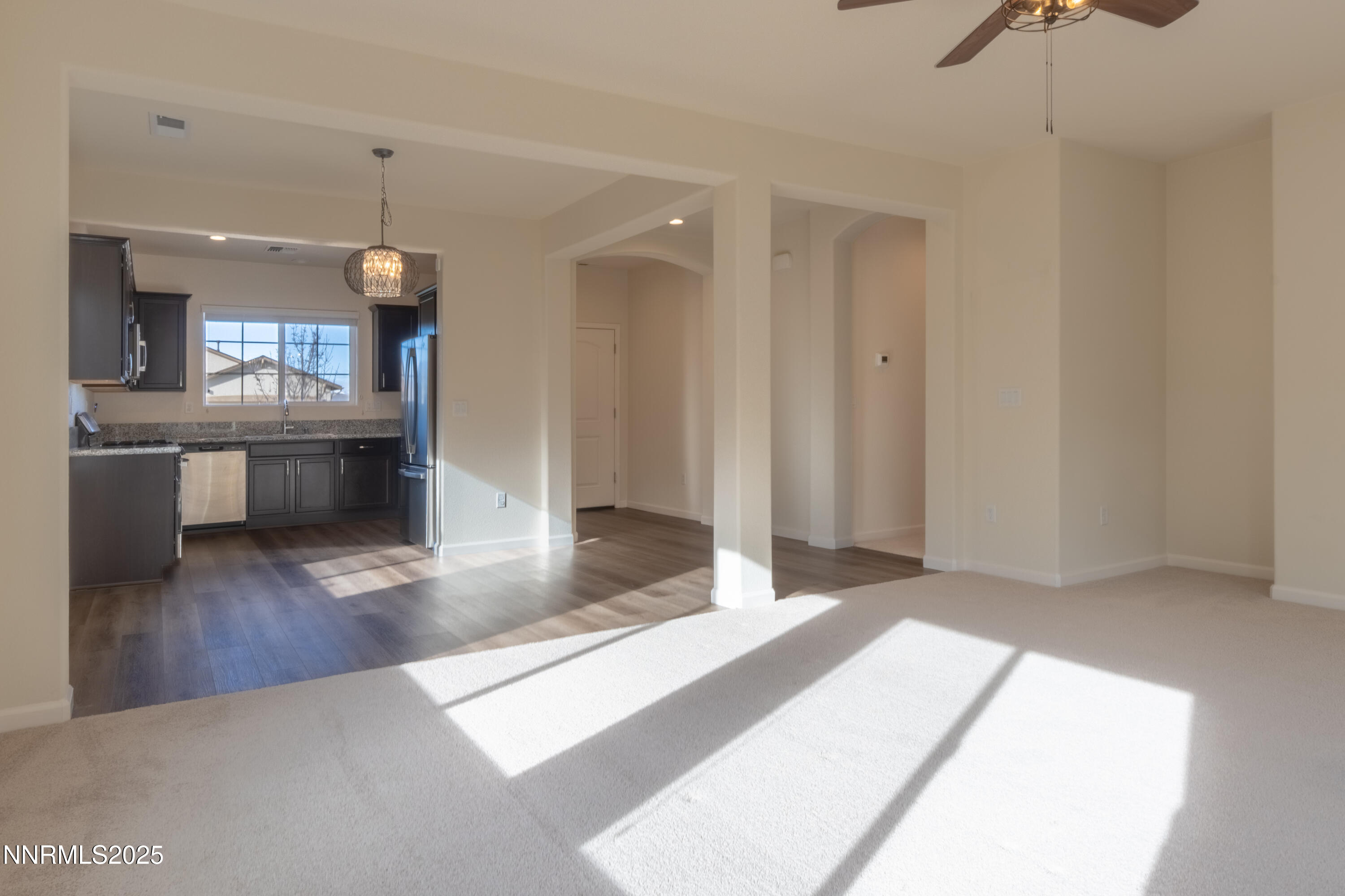 14524 Leiden Drive Reno, NV 89506 - Photo 9 of 33 a living room with stainless steel appliances kitchen island granite countertop furniture and a kitchen view