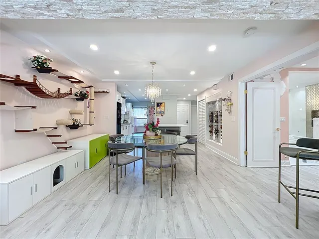 a kitchen with a table and chairs in it