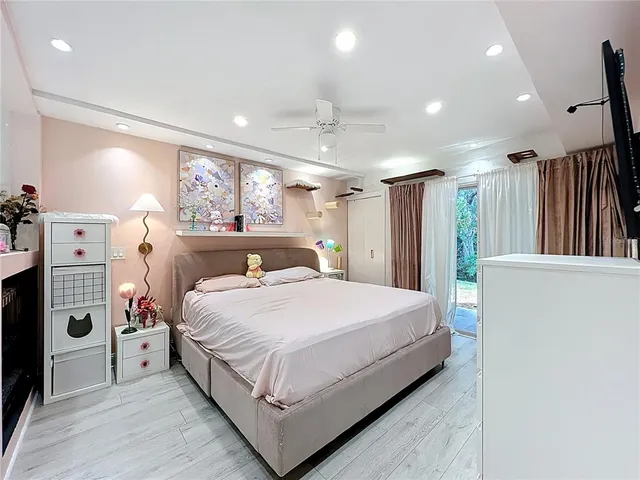 a large white bed in a white room