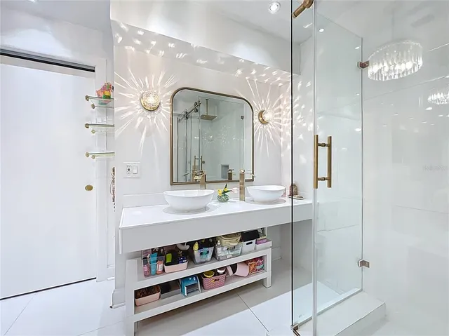 a bathroom with a double vanity sink and a mirror