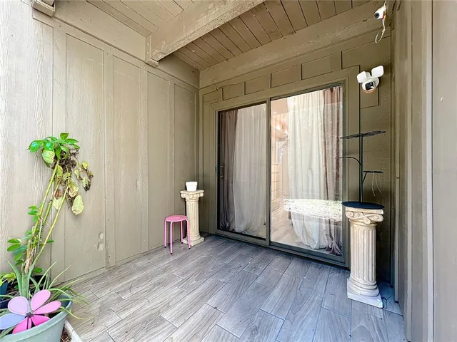 a view of an empty room and a window