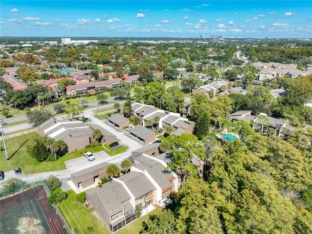 an aerial view of residential houses with outdoor space