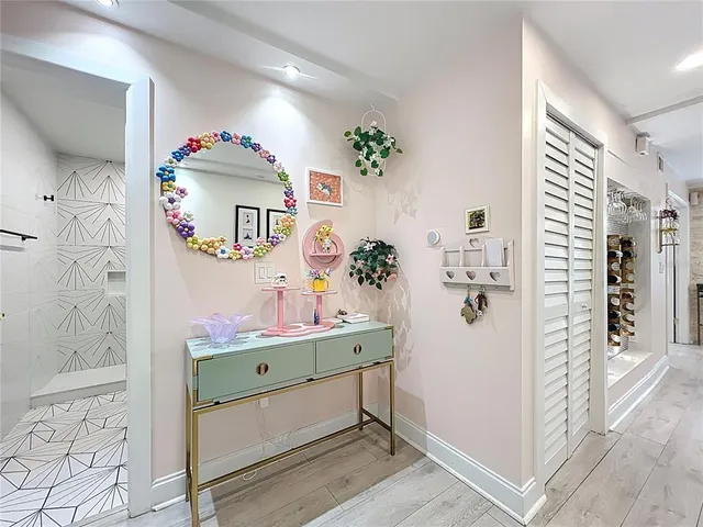a view of bathroom with a window and chair