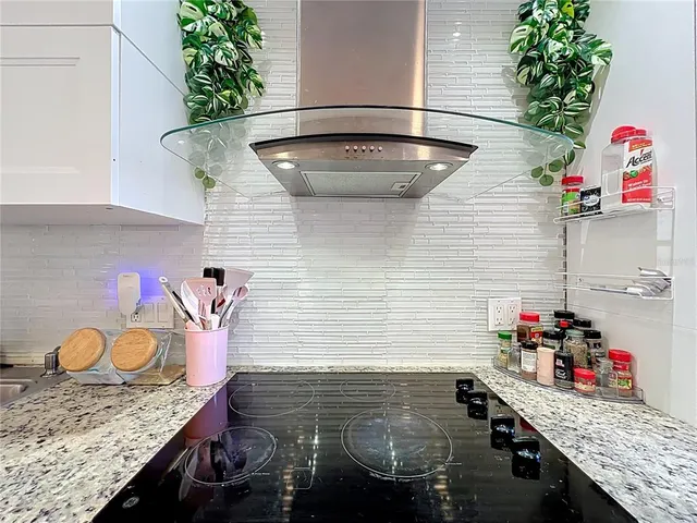 a bathroom with a sink and a potted plant