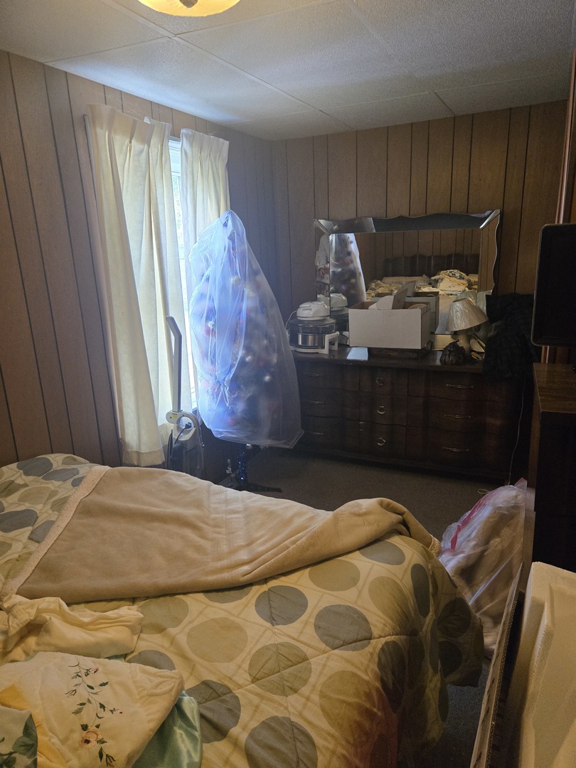 2038 Ruby Street Melrose Park, IL 60164 - Photo 9 of 13 a bed sitting in a bedroom next to a window