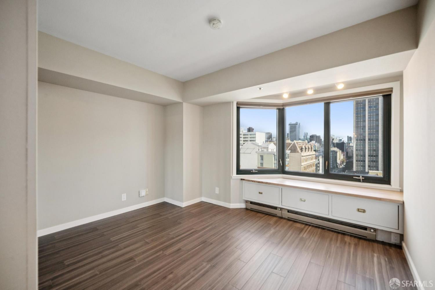 601 Van Ness Avenue, Unit 812 San Francisco, CA 94102 - Photo 21 of 33 a view of a room with wooden floor and window