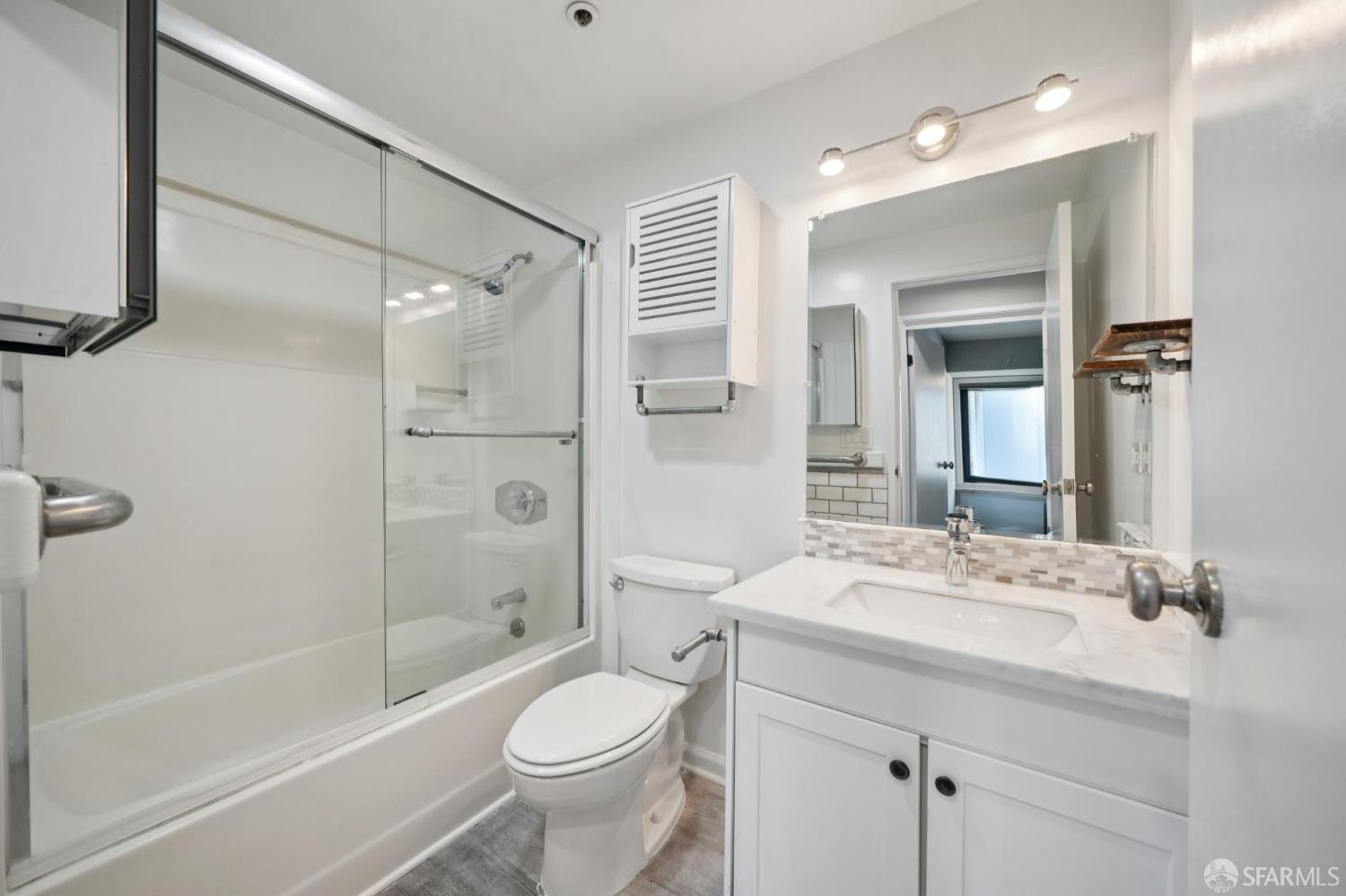 601 Van Ness Avenue, Unit 812 San Francisco, CA 94102 - Photo 27 of 33 a bathroom with a sink a toilet and shower