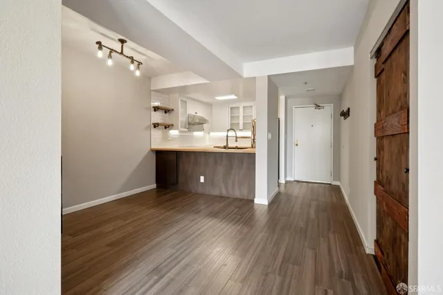 a view of a kitchen from the hallway