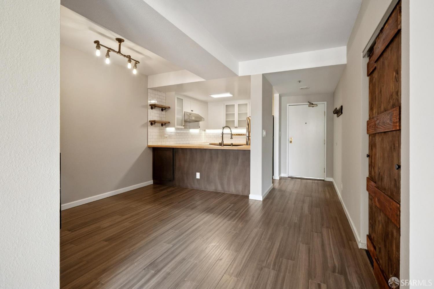 601 Van Ness Avenue, Unit 812 San Francisco, CA 94102 - Photo 6 of 33 a view of a kitchen from the hallway