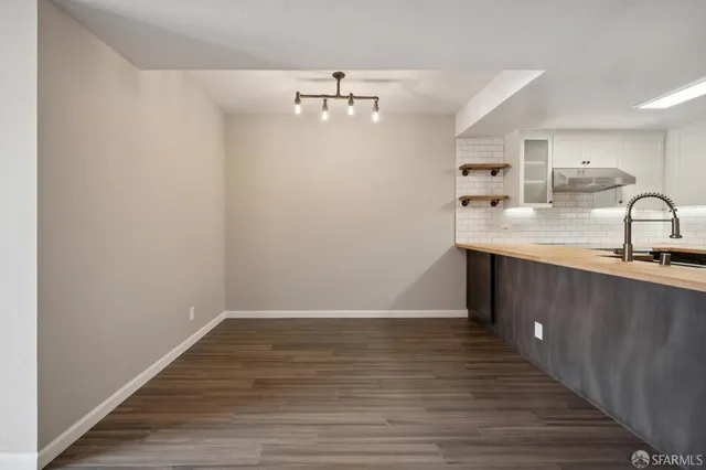 a view of a kitchen from the hallway