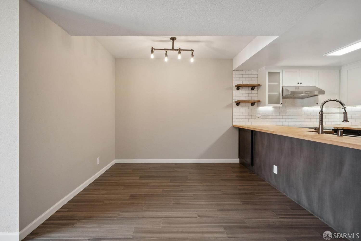 601 Van Ness Avenue, Unit 812 San Francisco, CA 94102 - Photo 10 of 33 a view of a kitchen from the hallway