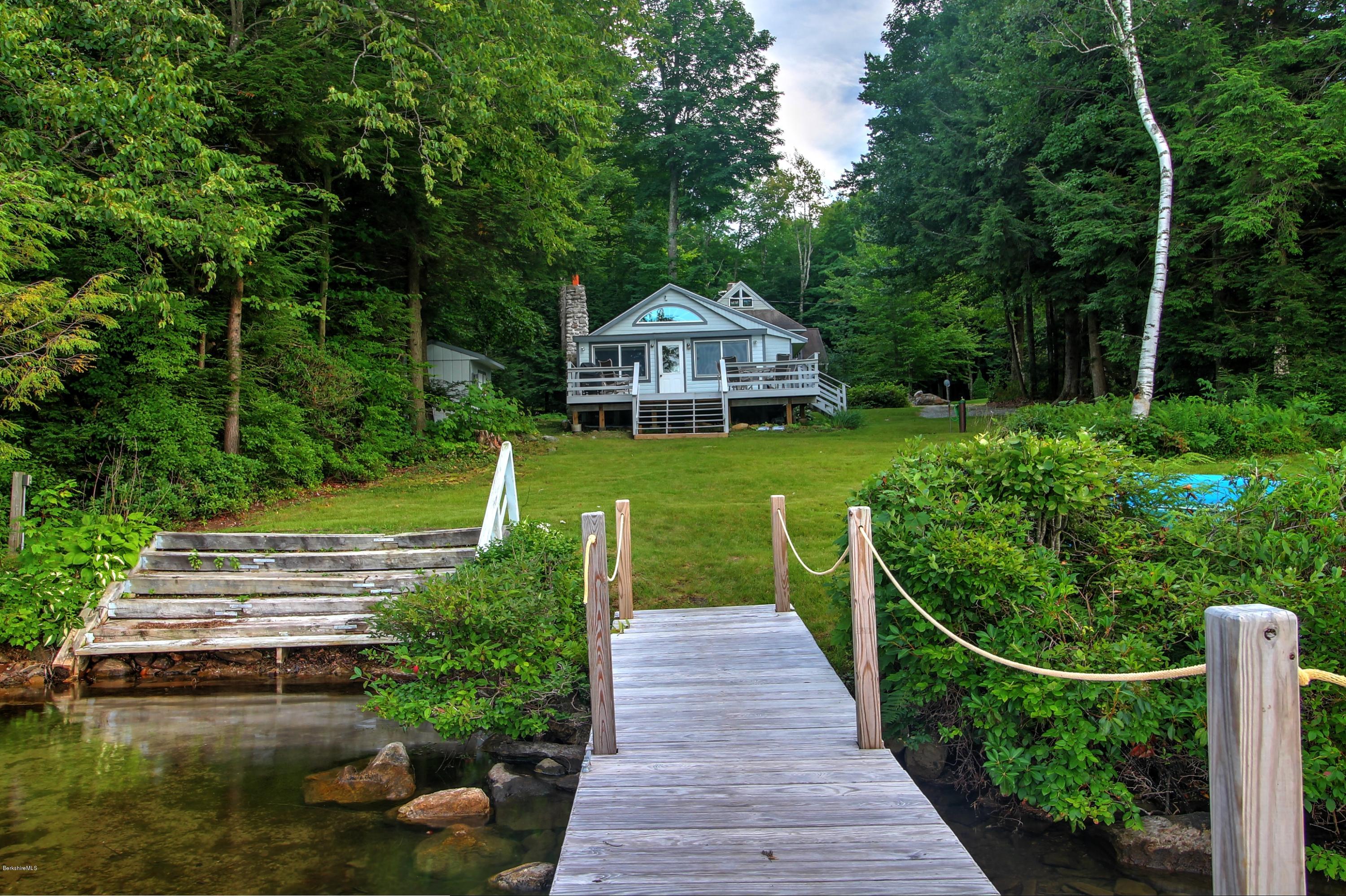 59 Williams Road Becket, MA 01223 - Photo 1 of 18 a front view of a house with a yard