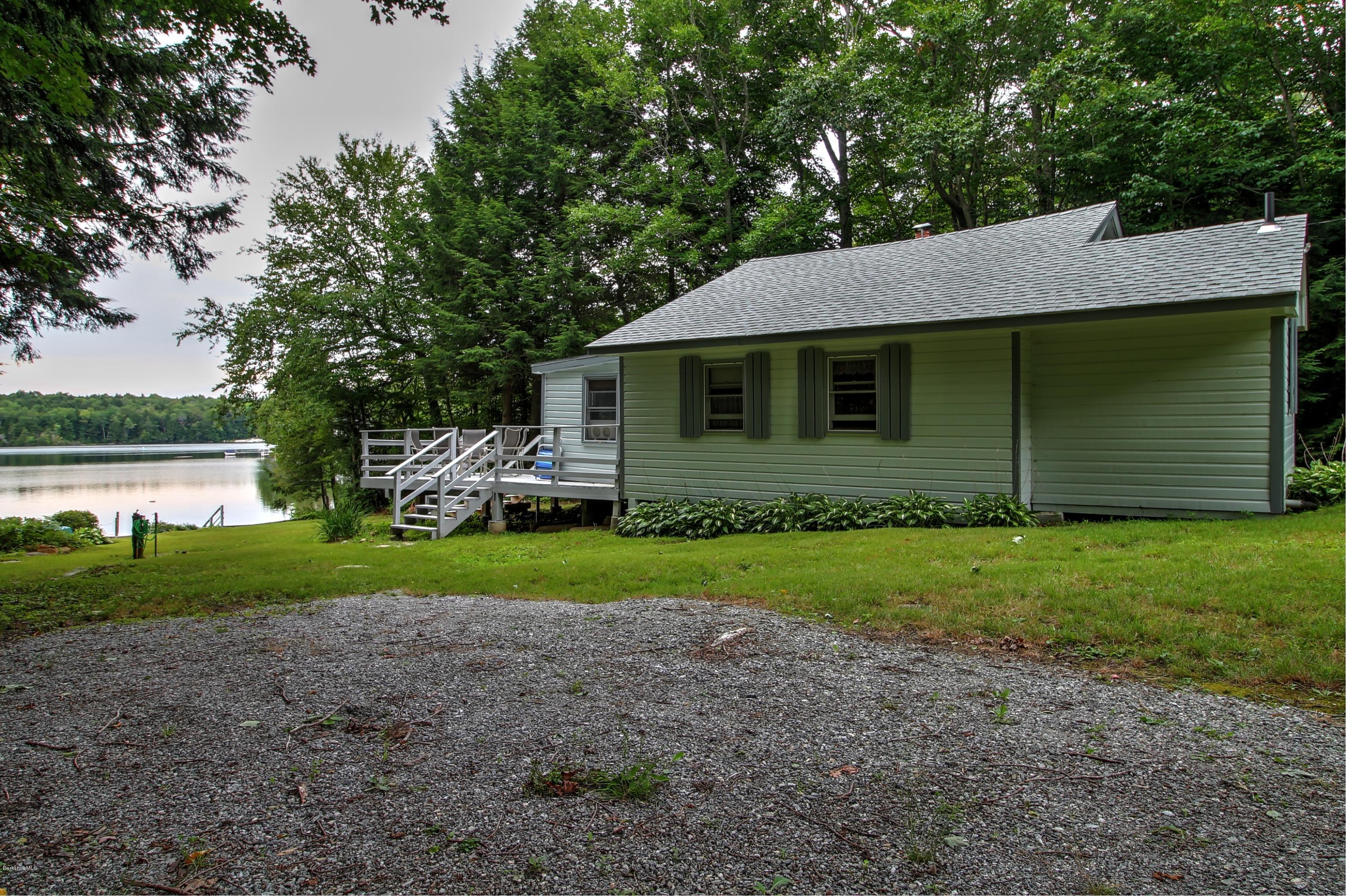 59 Williams Road Becket, MA 01223 - Photo 11 of 18 a front view of a house with garden