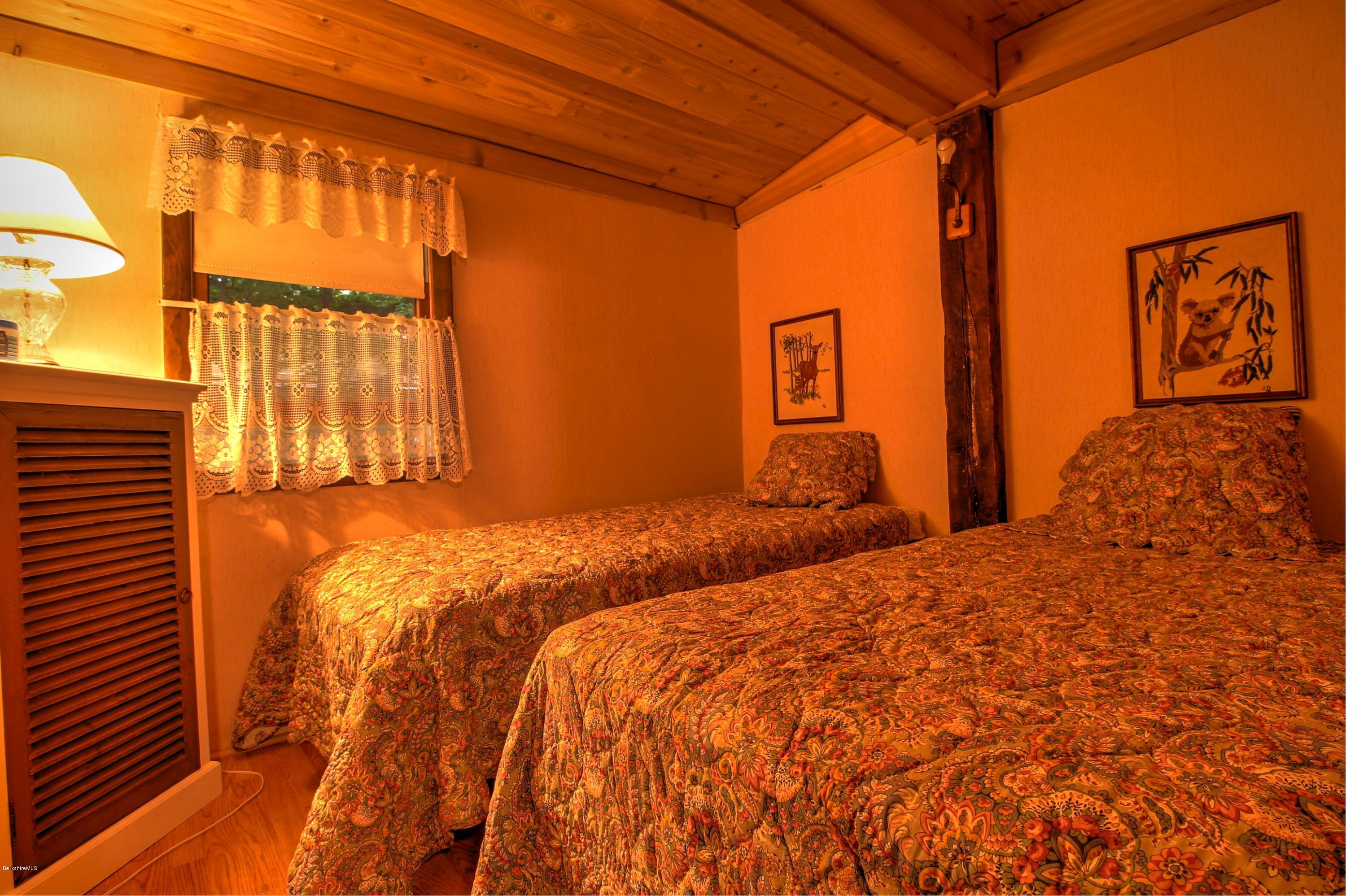 59 Williams Road Becket, MA 01223 - Photo 13 of 18 a bedroom with two beds and a window
