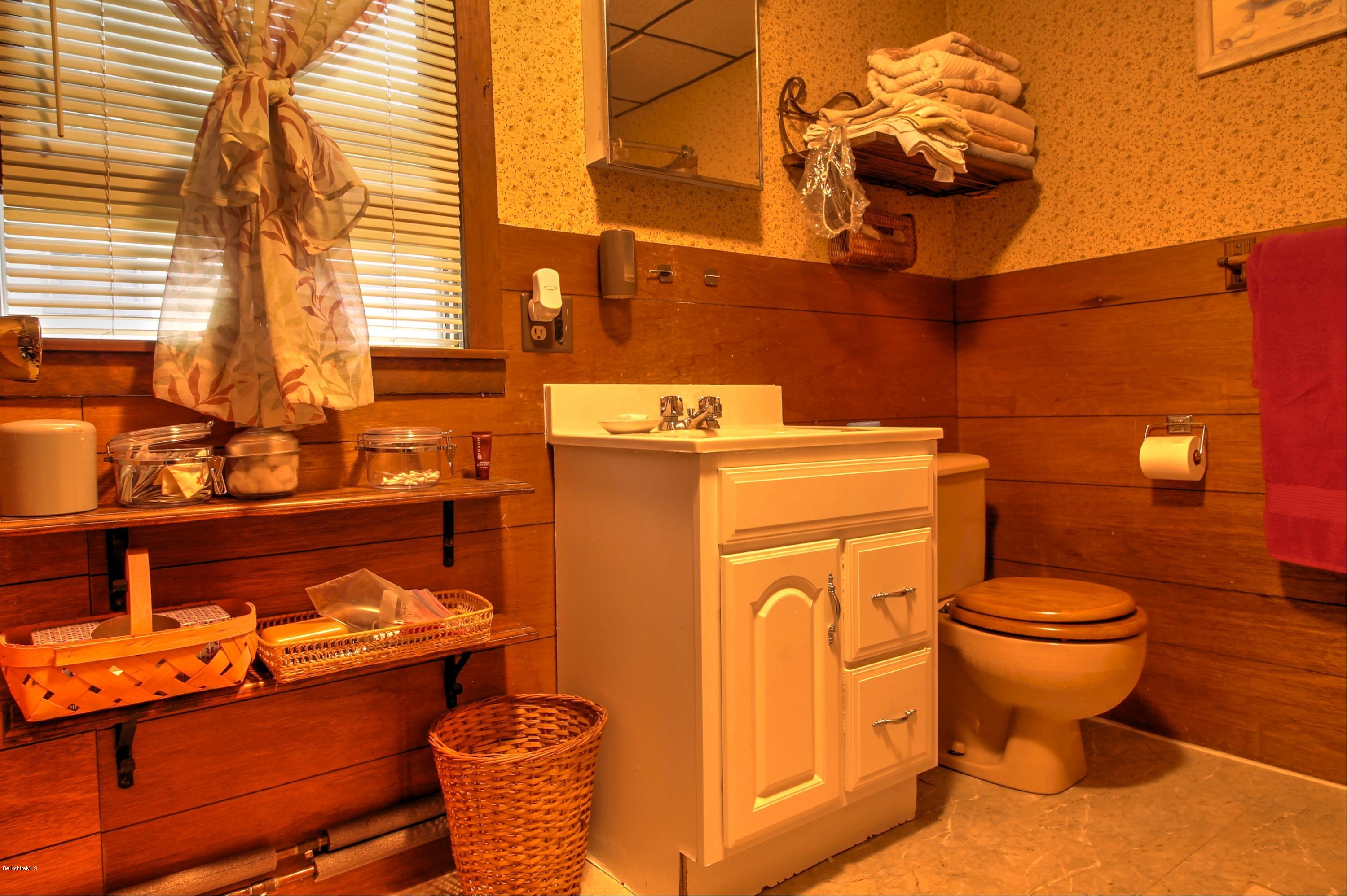 59 Williams Road Becket, MA 01223 - Photo 14 of 18 a bathroom with a sink and a toilet