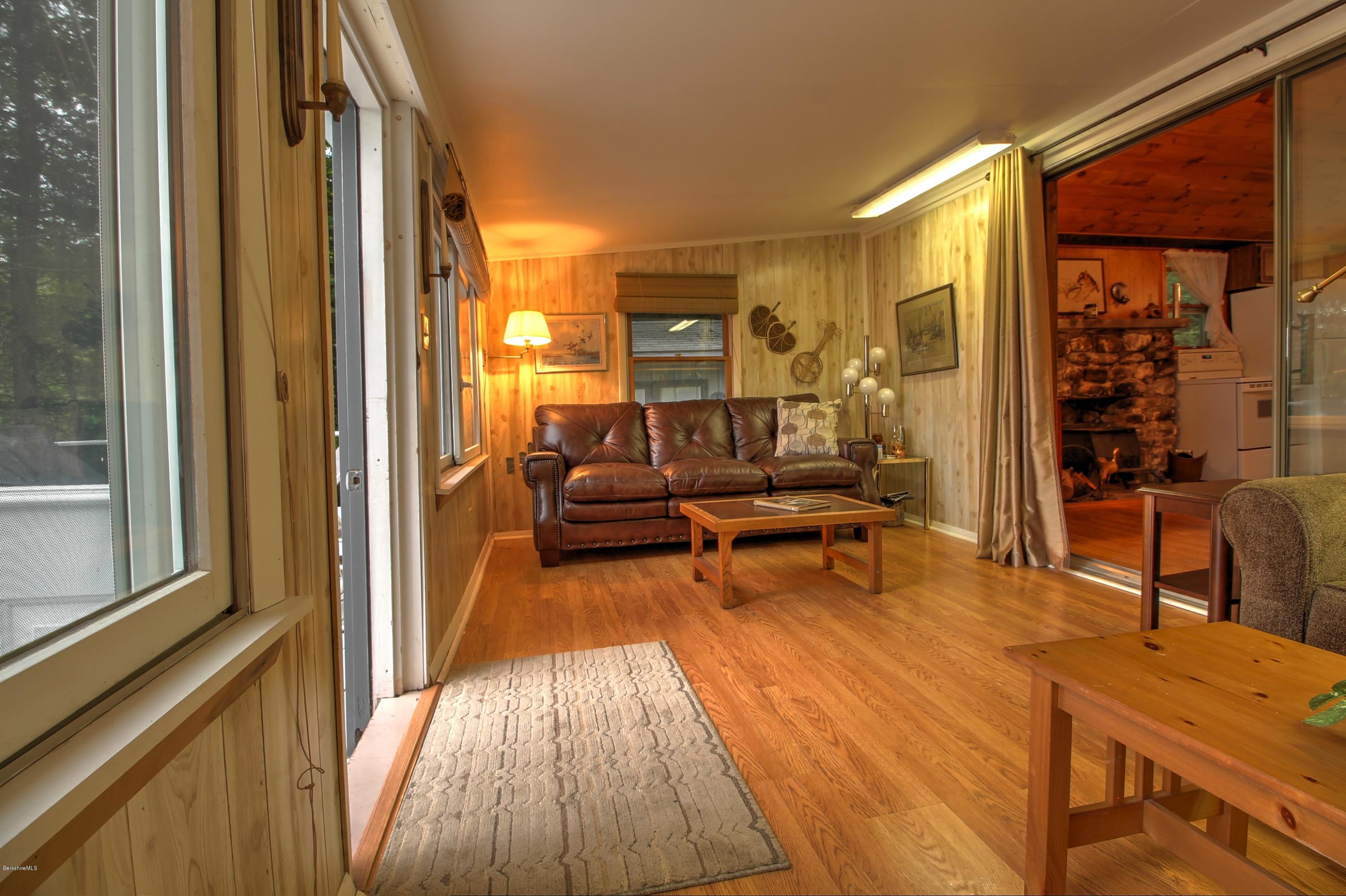 59 Williams Road Becket, MA 01223 - Photo 8 of 18 a living room with furniture and a wooden floor