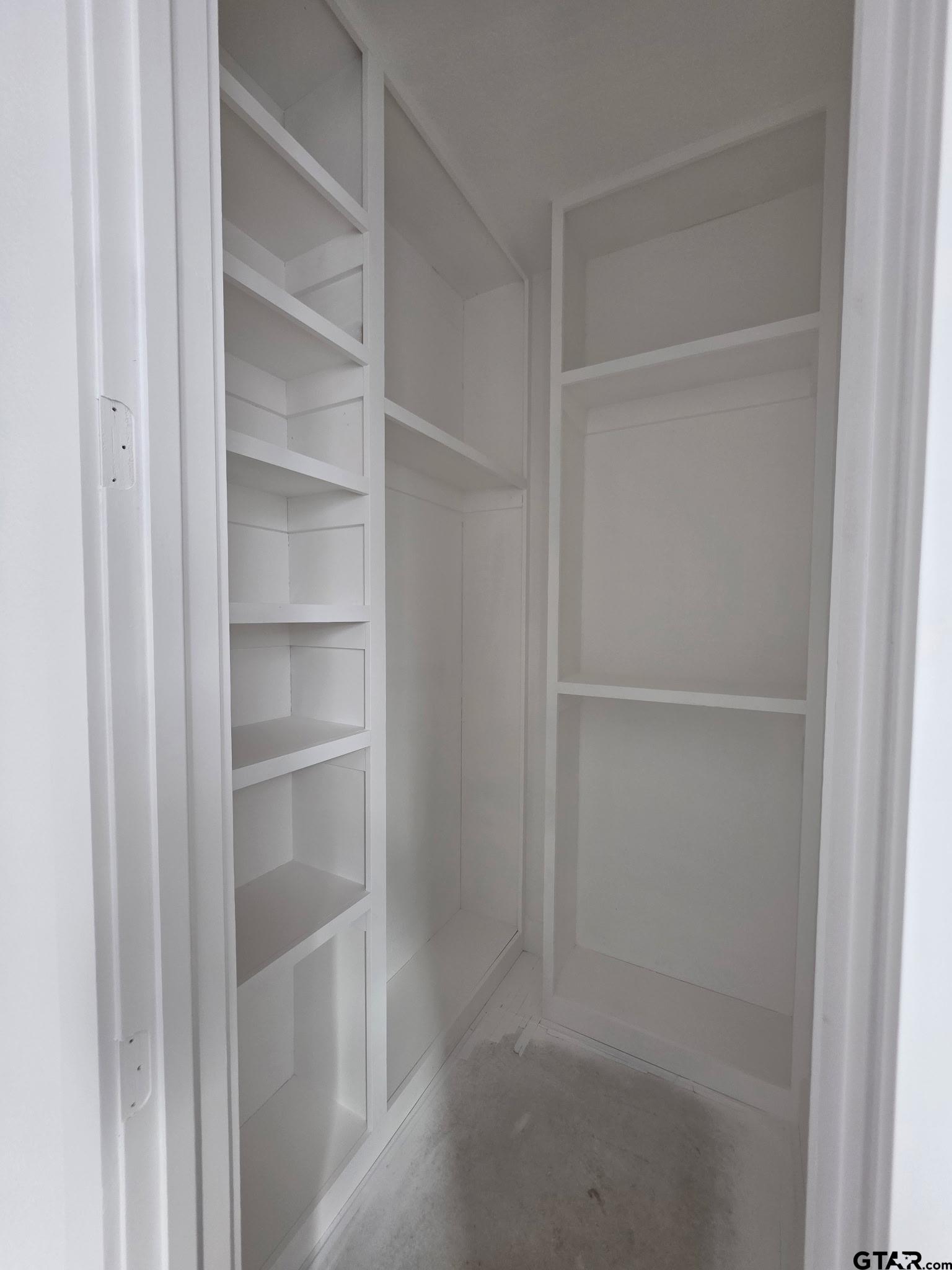 2712 Tbd Private Road Mount Pleasant, TX 75455 - Photo 6 of 18 a view of walk in closet with empty racks