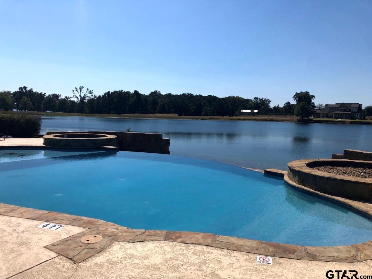 2712 Tbd Private Road Mount Pleasant, TX 75455 - Photo 10 of 18 a view of a lake with houses in the back