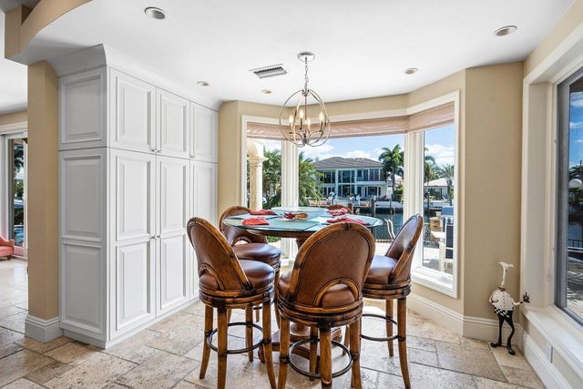a dining room with furniture window and outside view