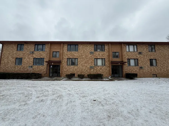 a view of an empty room with a fireplace