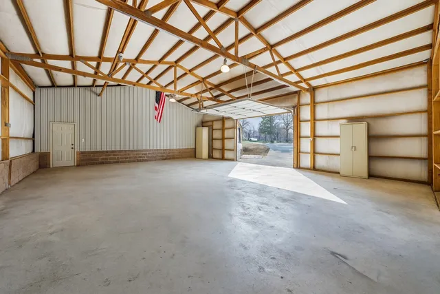 a kitchen filled with stainless steel appliances granite countertop a sink and cabinets