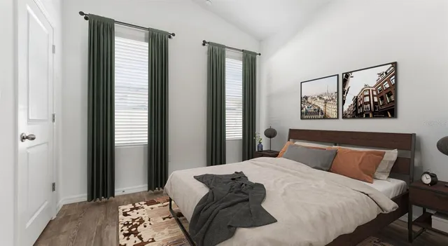 a living room with furniture kitchen view and a dining table
