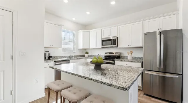 a bedroom with a bed and furniture