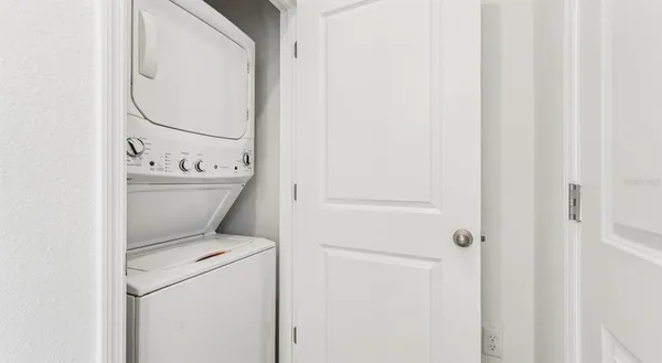 a bathroom with a granite countertop toilet a sink and a bathtub