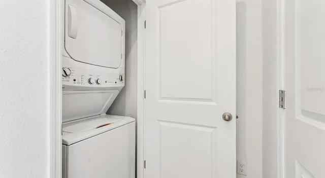 a bathroom with a granite countertop toilet a sink and a bathtub