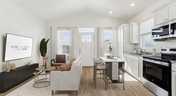 a kitchen with stainless steel appliances a refrigerator stove microwave and cabinets