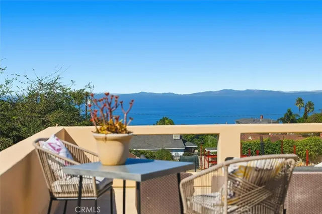 a view of a dining table and chairs in the patio