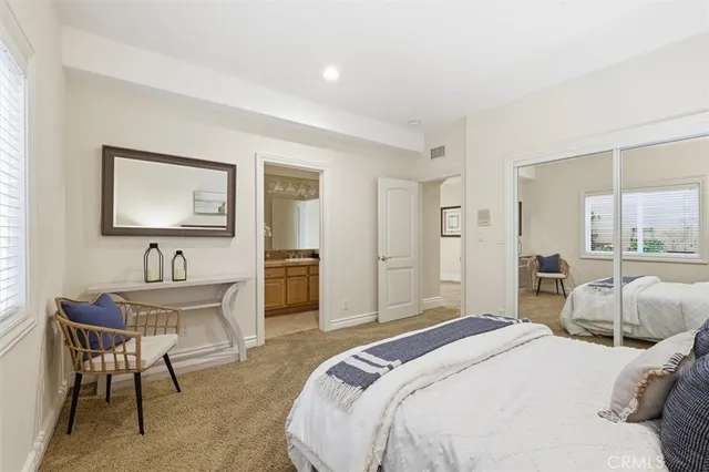 a bedroom with a bed and a table