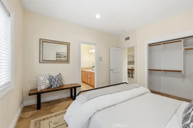 a bedroom with a bed and furniture