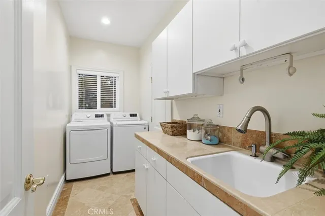 a bathroom with a sink and a washing machine