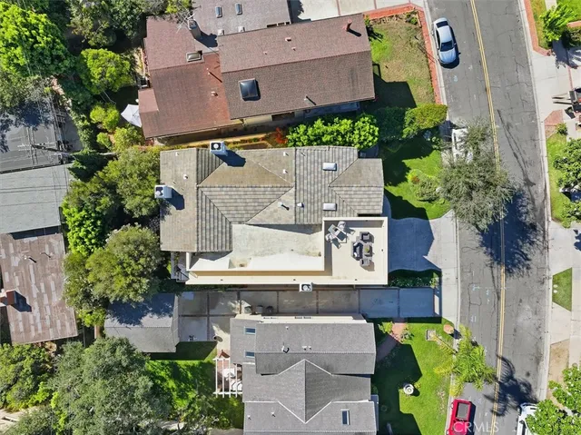 an aerial view of residential house with outdoor space and swimming pool
