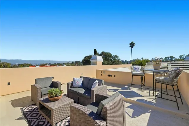 a terrace of a house with outdoor seating