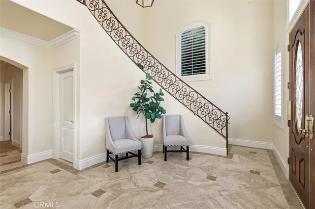 a living room with furniture and a stairs