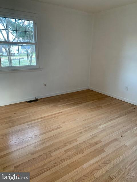 3121 Mt Zion Road Upperco, MD 21155 - Photo 16 of 43 an empty room with wooden floor and windows