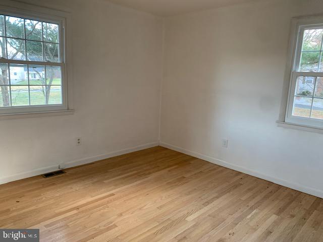 3121 Mt Zion Road Upperco, MD 21155 - Photo 17 of 43 an empty room with wooden floor and windows