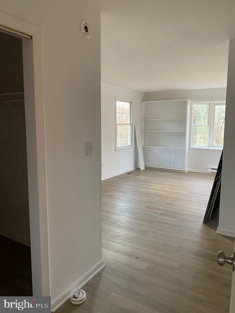 3121 Mt Zion Road Upperco, MD 21155 - Photo 18 of 43 an empty room with wooden floor and windows
