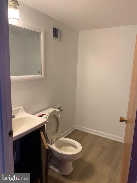 3121 Mt Zion Road Upperco, MD 21155 - Photo 38 of 43 a bathroom with a granite countertop toilet and a sink