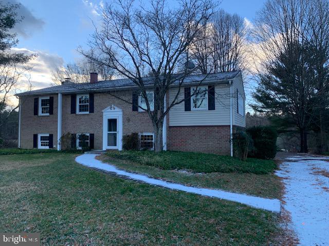 3121 Mt Zion Road Upperco, MD 21155 - Photo 43 of 43 a front view of a house with a yard and trees